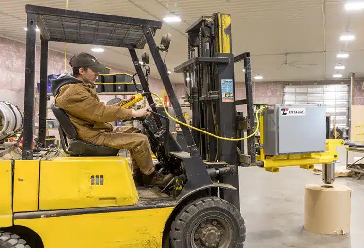 Two Employees Working On Part